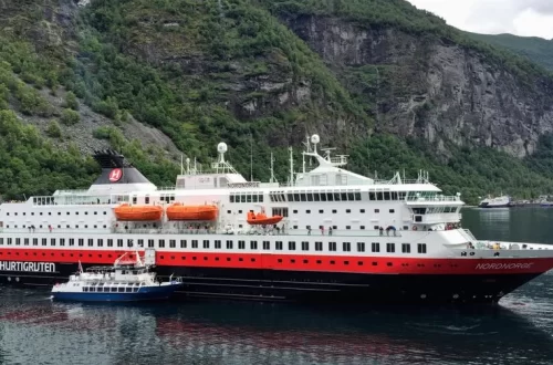 Hurtigruten ship sailing Norwegian fjord