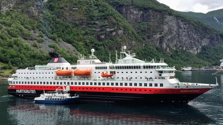 Hurtigruten ship sailing Norwegian fjord